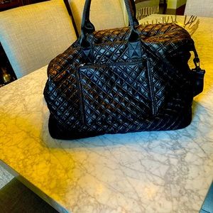 Designer quilted travel zipper bag with bamboo pulls.  Very roomy! Used ONCE!